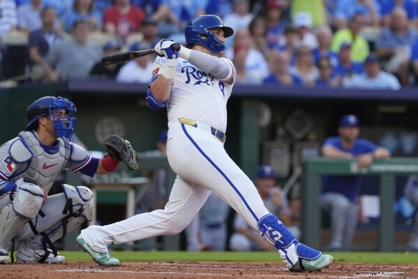 Kansas City Royals' Vinnie Pasquantino watches his three run home run during the first inning of a baseball game against the Texas Rangers, Wednesday, Aug. 20, 2025, in Kansas City, Mo. (AP Photo/Charlie Riedel)
