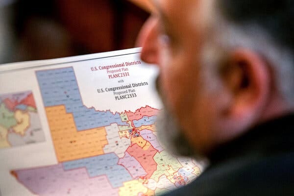A man out of focus holding a congressional map of Texas. A man out of focus holding a congressional map of Texas.