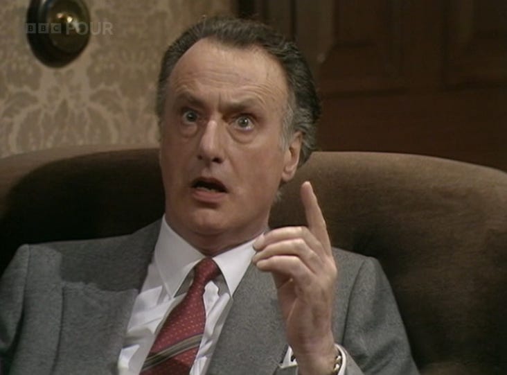 Jim Hacker pulls a very strong expression