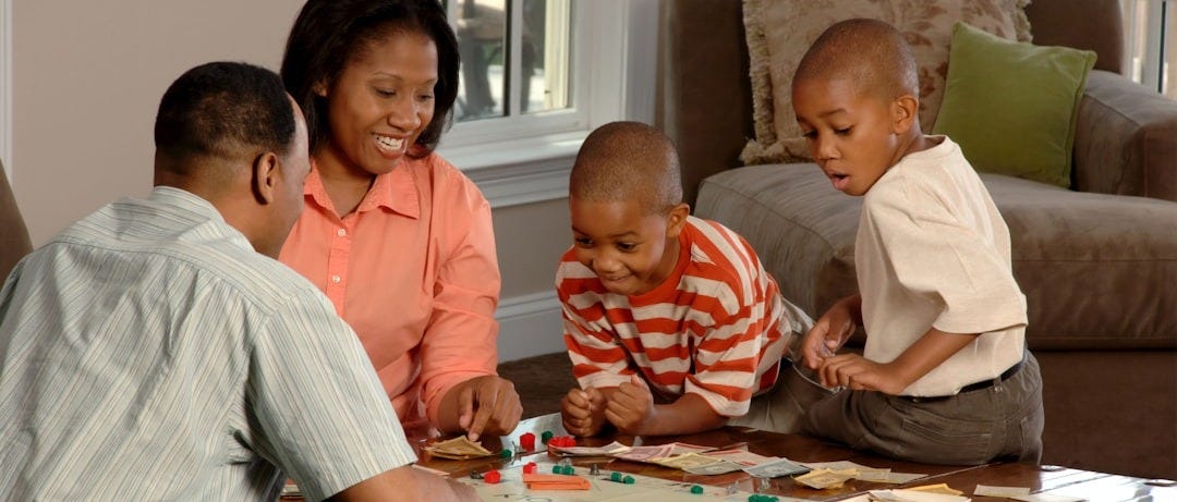 family playing board games