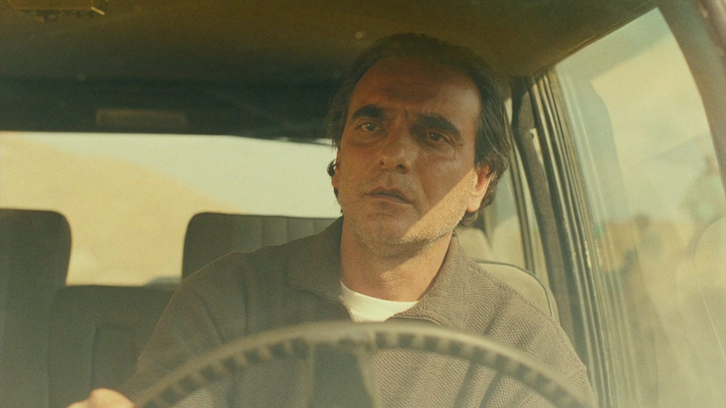 Taste of Cherry | Still features Homayoun Ershadi as Mr. Bodii driving off.