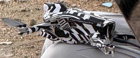 Leaked photos of two prototype drones reportedly developed by Insta360. One features a foldable frame with zebra camouflage and a dual-lens 360° camera module labeled “ANTIGRAVITY.” The second is a compact FPV-style drone with ducted fans, designed for agile or indoor flight. Close-up shots reveal modular components and panoramic imaging systems that mirror Insta360’s patented designs. The images are believed to originate from a private field test and align with newly disclosed corporate and investor filings.