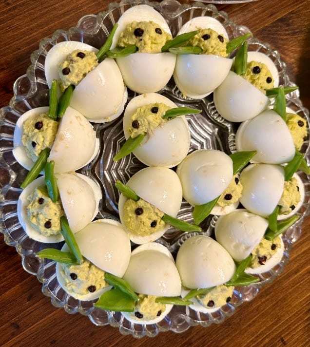 A plate of deviled eggs

AI-generated content may be incorrect.