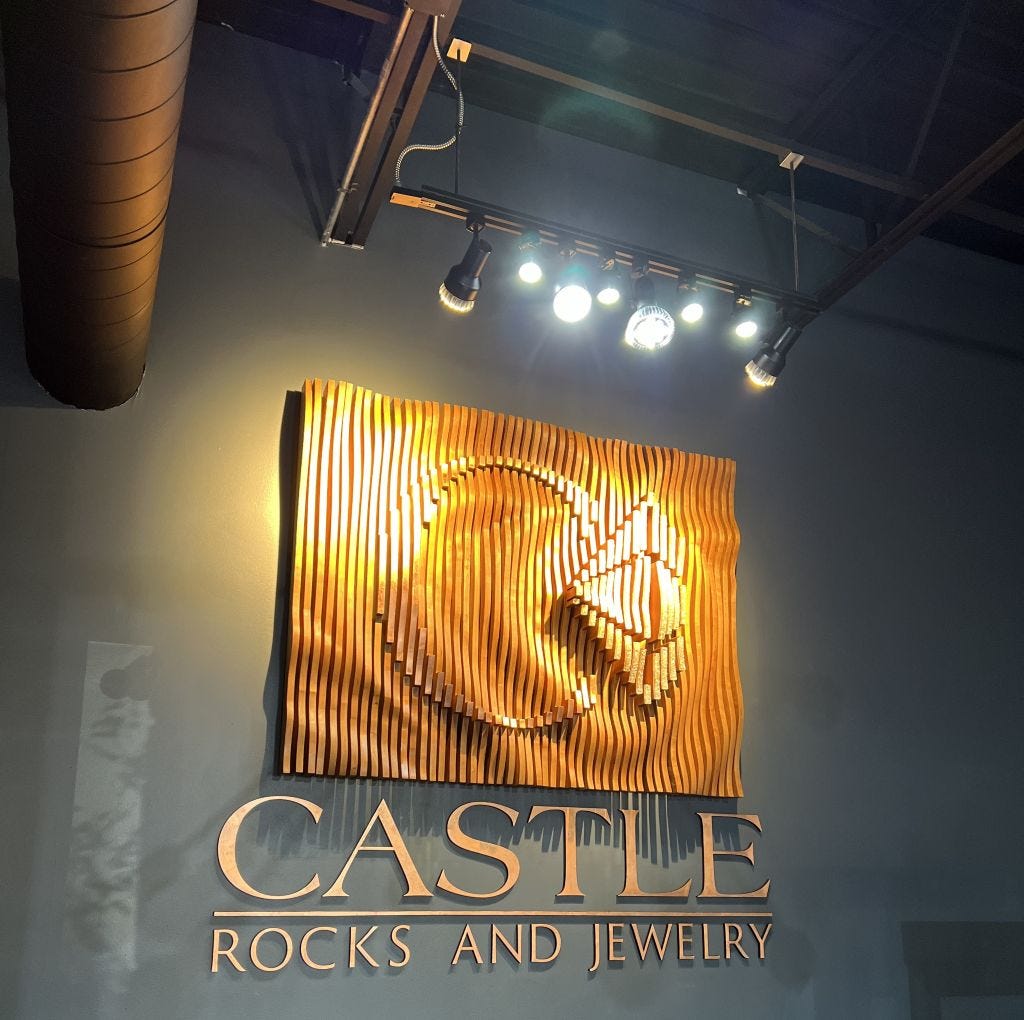 a solid cherry business sign made from thin strips of cherry with elements protruding which carry the ring and diamond logo a solid cherry business sign made from thin strips of cherry with elements protruding which carry the ring and diamond logo