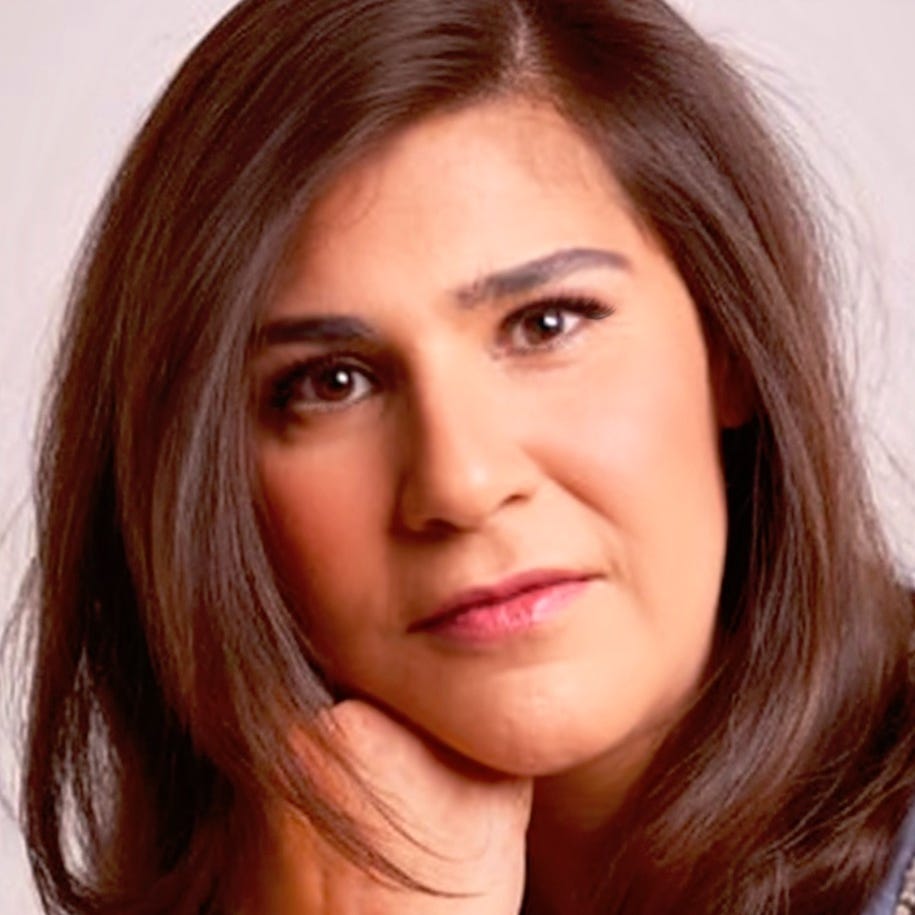 Reenita’s Storyteller Den logo