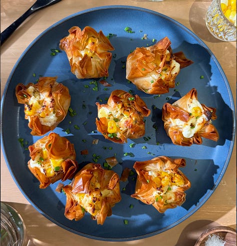Collage of 7 easy summer appetizer recipes including golden fried zucchini blossoms, crispy eggplant rounds, loaded smashed potatoes, corn rangoons, panko-crusted goat cheese balls, pea fritters, and olive crostini - all ready in 30 minutes or less