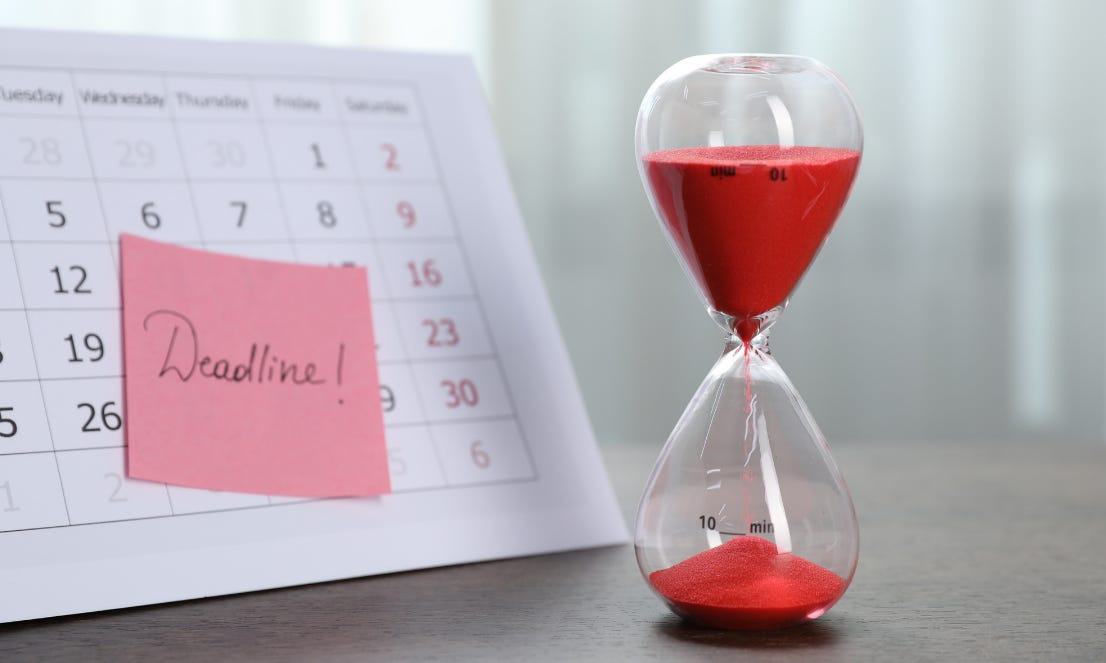 A calendar with a sticky note reading "deadline" next to an hourglass with red sand. A calendar with a sticky note reading "deadline" next to an hourglass with red sand.