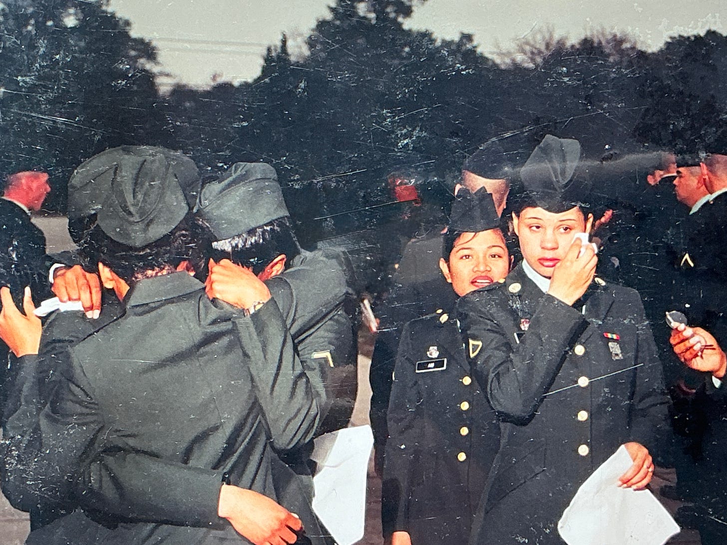 Several women embracing and in tears crying at US Army graduation day Fort Jackson South Carolina 1998