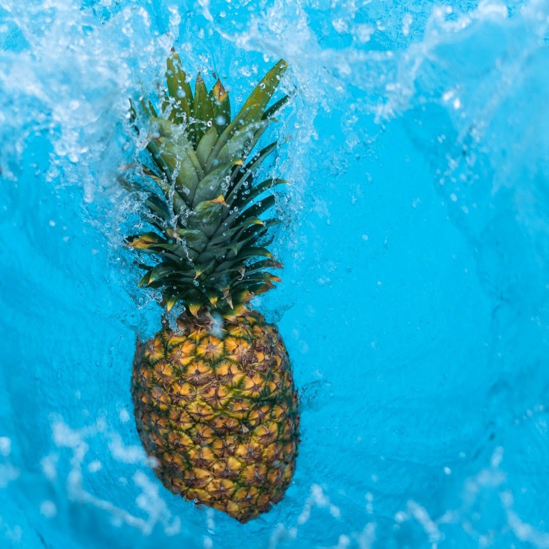 a pineapple in water a pineapple in water
