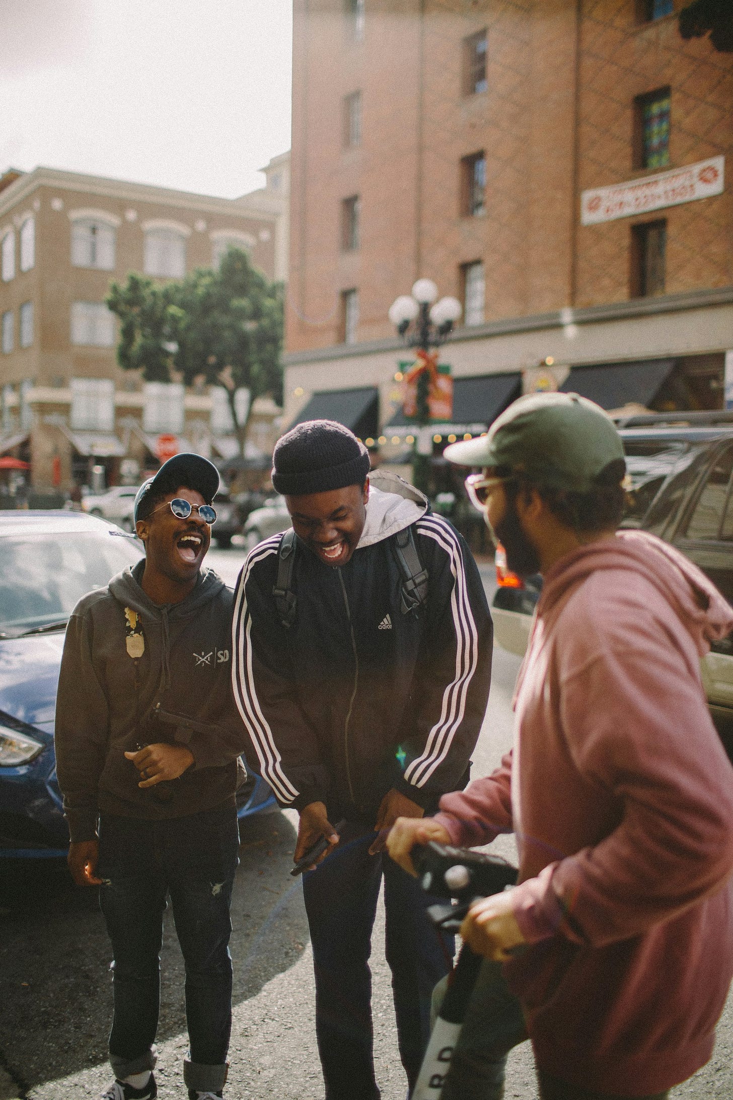 three men in jacket laughing at each other three men in jacket laughing at each other