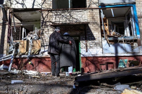 A couple enter a residential building damaged by a Russian missile strike in Kramatorsk. A couple enter a residential building damaged by a Russian missile strike in Kramatorsk.