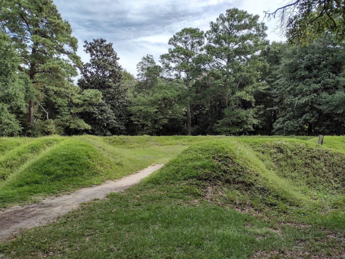 Circle of lawn-covered earthworks