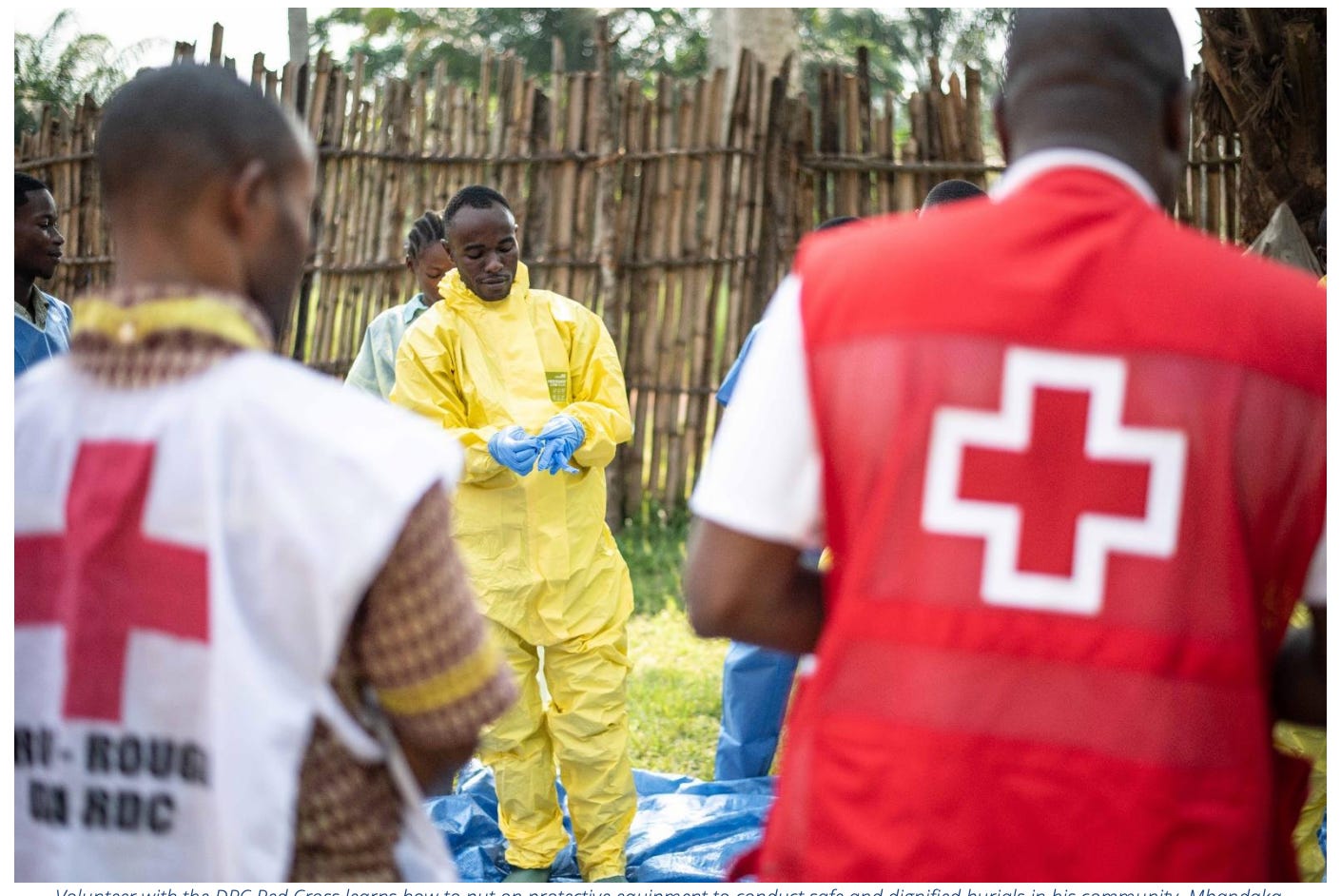 Volunteer with the DRC Red Cross learns how to put on protective equipment to conduct safe and dignified burials in his community, Mbandaka,” Equateur. Volunteer with the DRC Red Cross learns how to put on protective equipment to conduct safe and dignified burials in his community, Mbandaka,” Equateur.