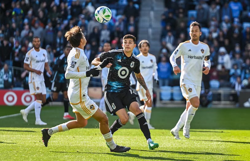 Minnesota United defender Anthony Markanich competes for the ball