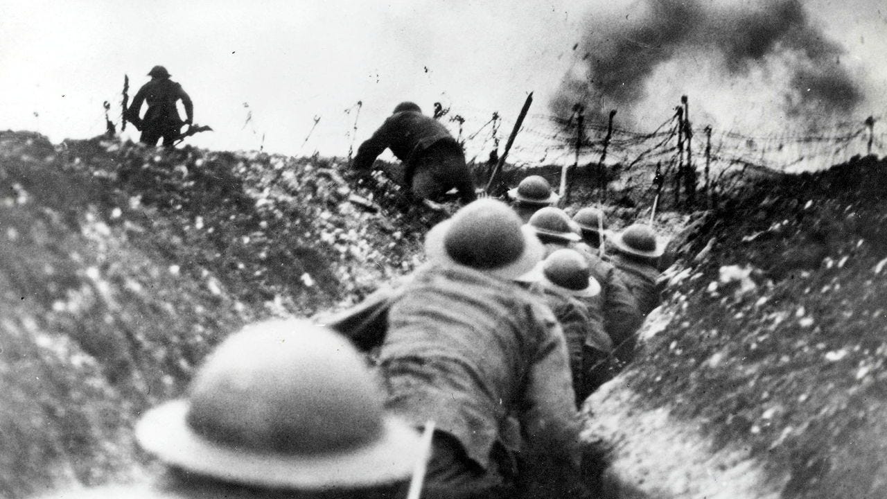 A black and white image of British troops go over the top of the trenches during the Battle of the Somme in 1916.
