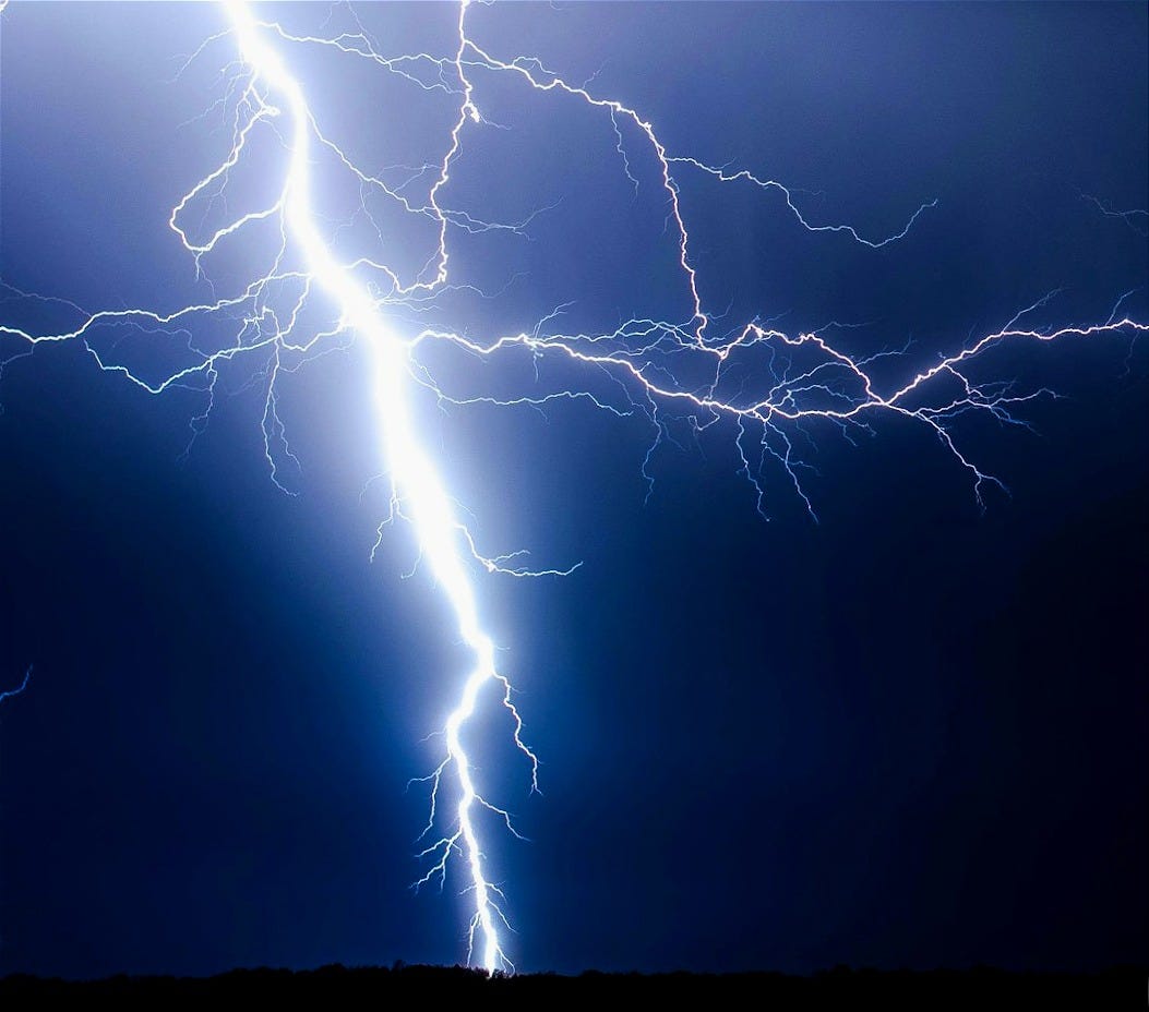 lightning strike during blue sky lightning strike during blue sky