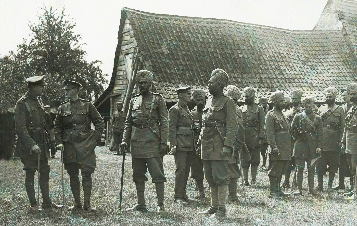 British and Indian officers of the 15th Ludhiana Sikhs, photographed by H. D. Girdwood in a French farmyard at Le Sart, France, 24 July 1915