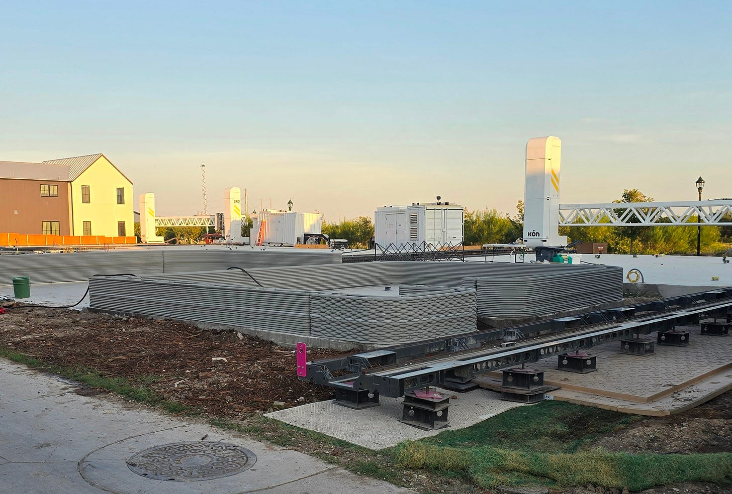 3D-printed houses in the early stages of construction. Photo credit: Claus Wilke