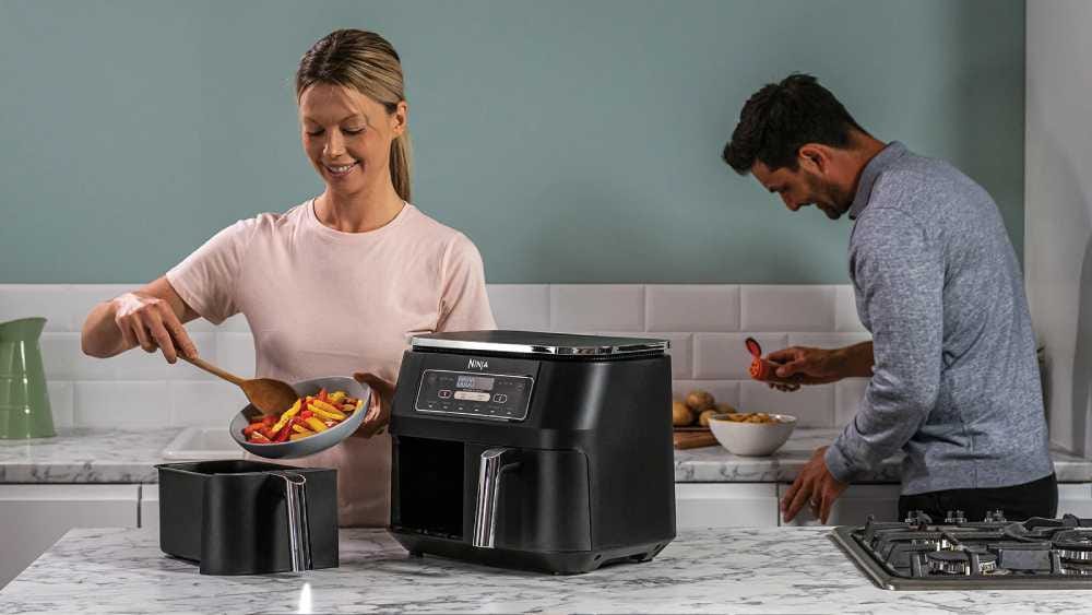 Man and woman using Ninja Air Fryer Man and woman using Ninja Air Fryer