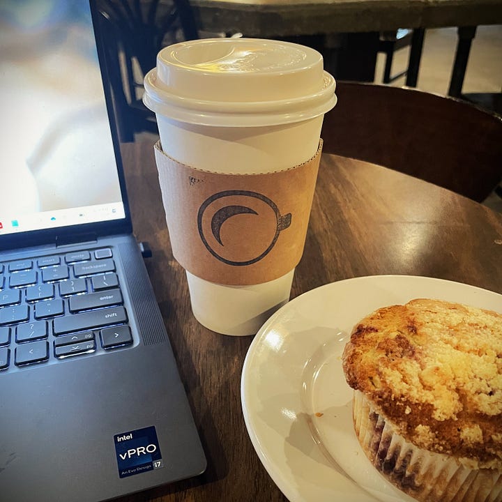Raspberry Muffins and a To-Go Cup At Crescent Moon Coffee