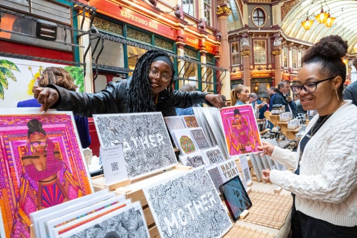 Things to do in London this weekend: a stallholder talking to a customer at a craft fair in Leadenhall Things to do in London this weekend: a stallholder talking to a customer at a craft fair in Leadenhall