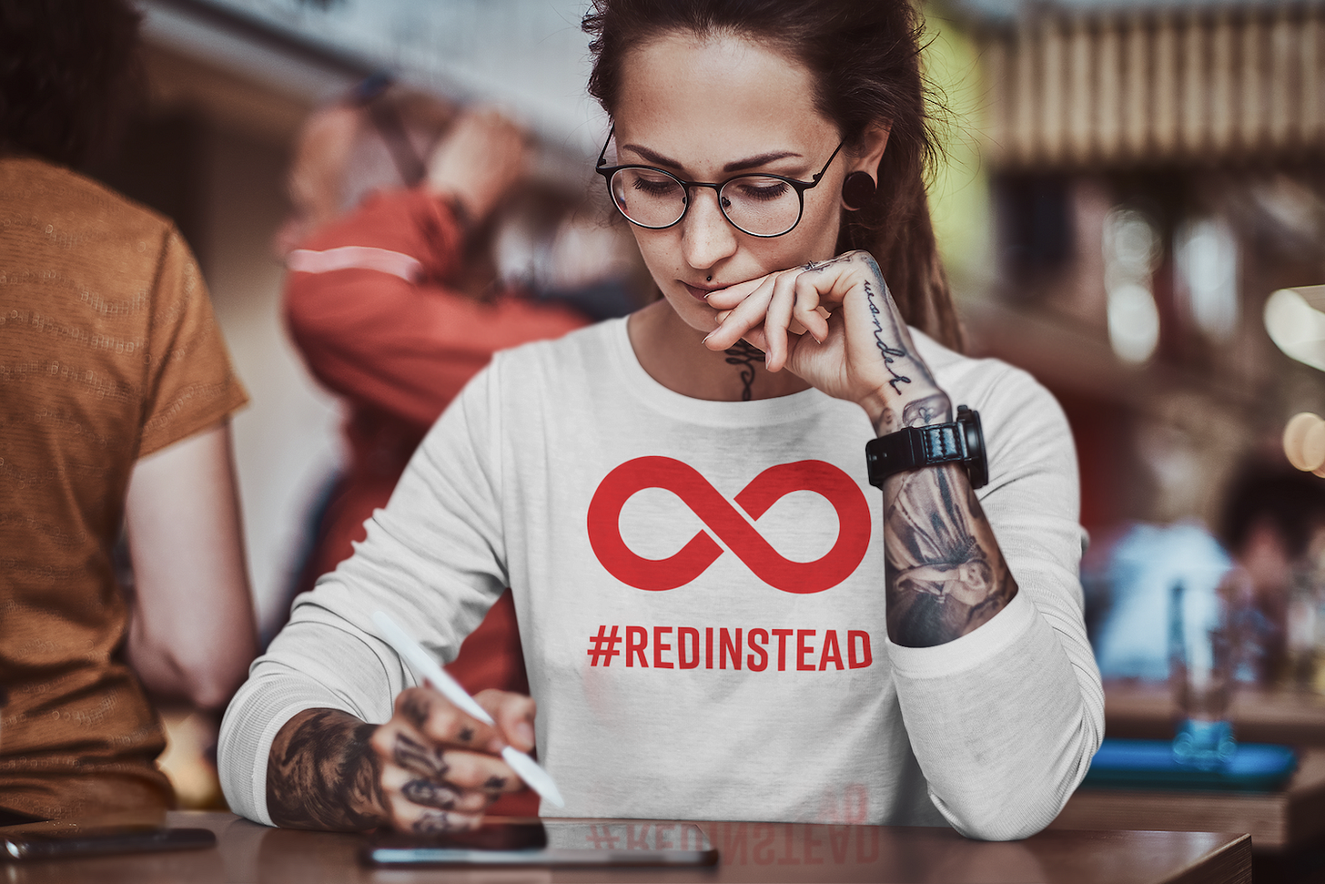 A person wearing a red autism acceptance shirt A person wearing a red autism acceptance shirt