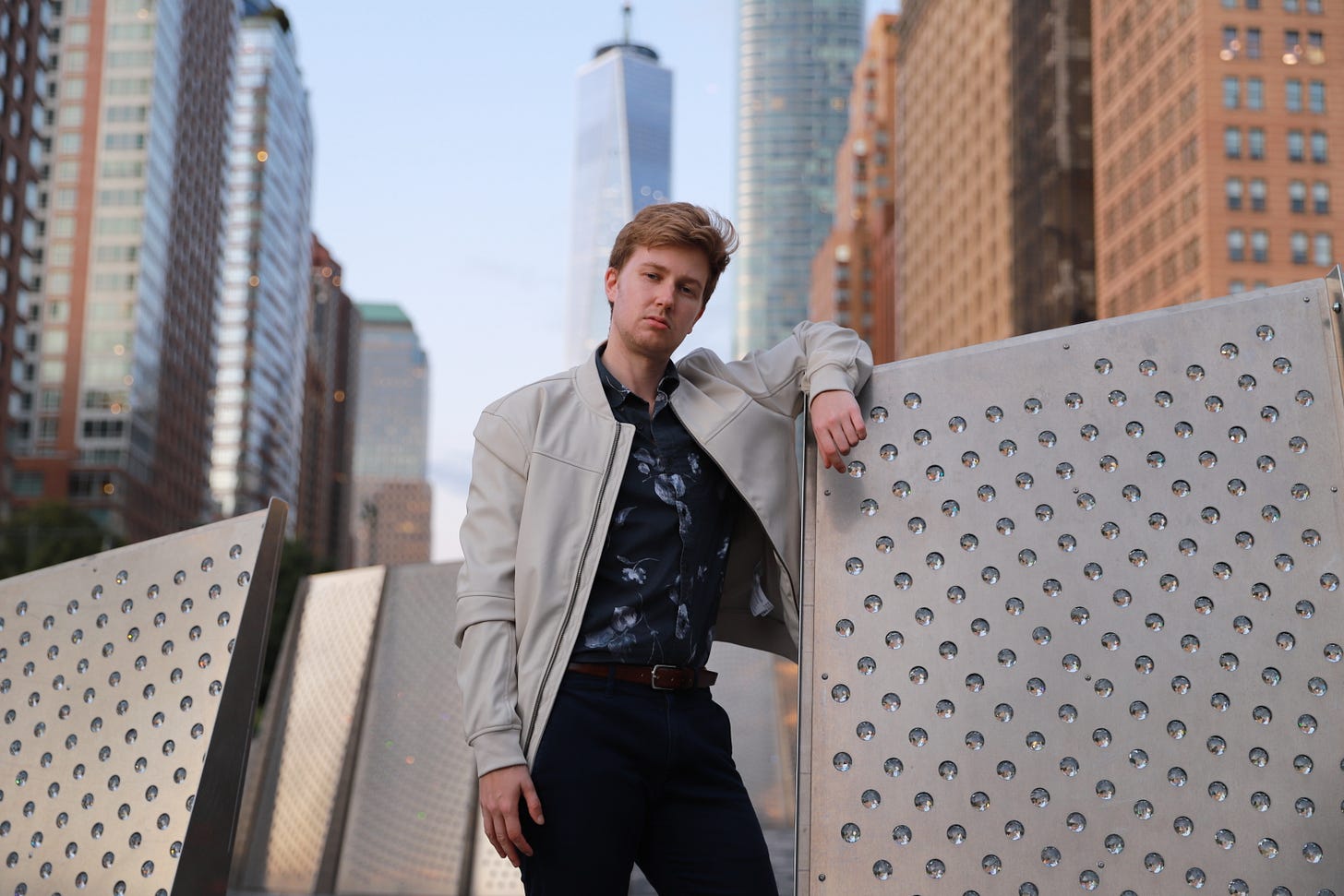 young gay trans man standing in downtown NYC young gay trans man standing in downtown NYC