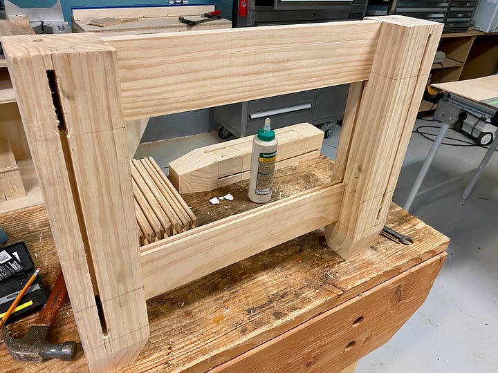 Dadoes and tenons being cut and wood pieces being dry-fit together
