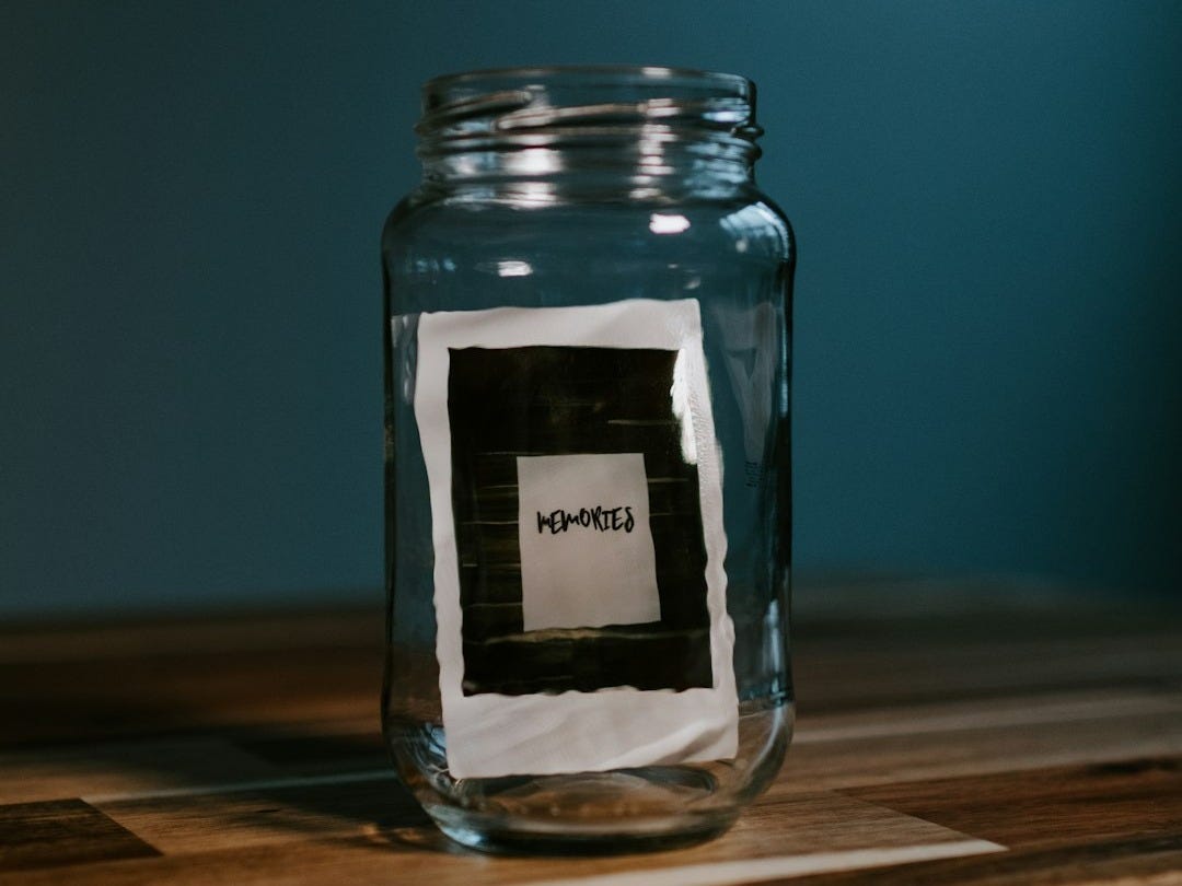 clear glass jar on brown wooden table clear glass jar on brown wooden table