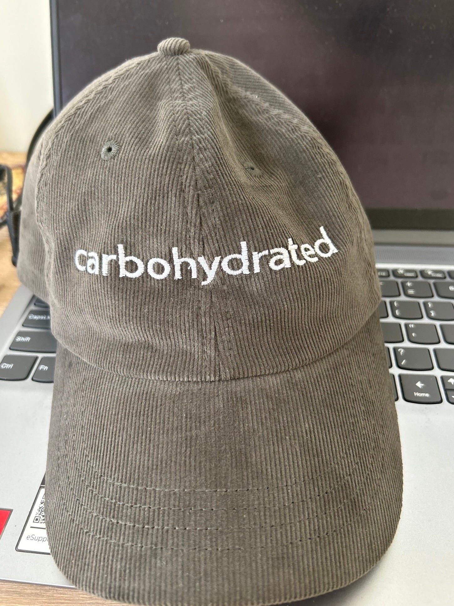May be an image of hat and text