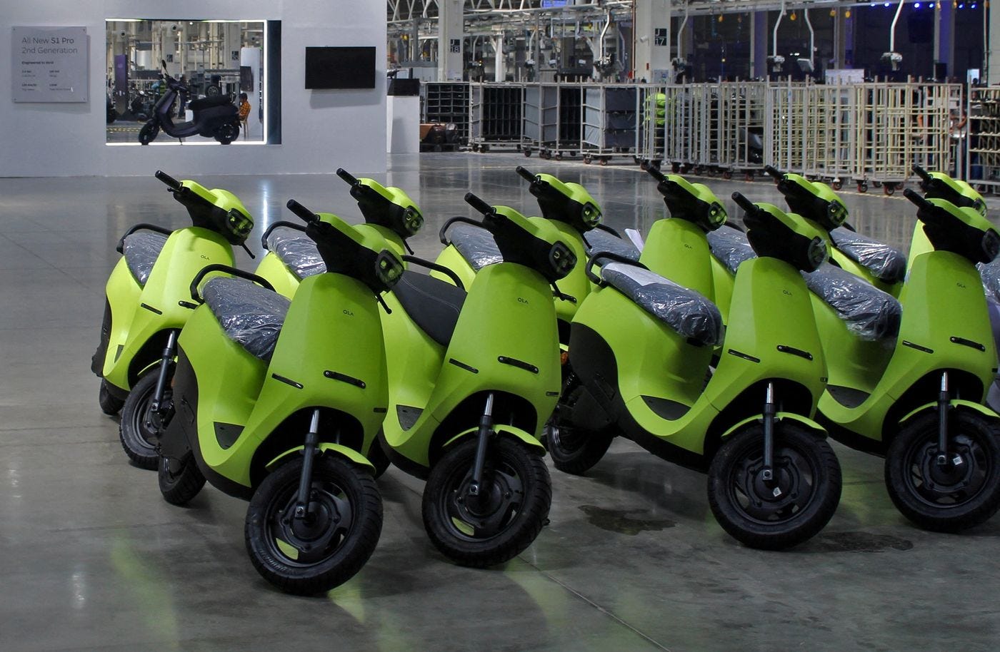 A group of green scooters

Description automatically generated