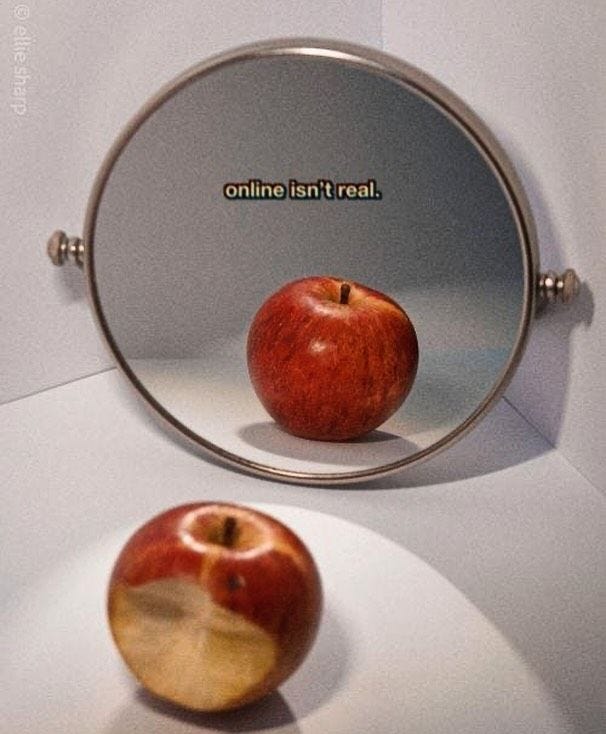 This may contain: an apple sitting in front of a mirror with the words online isn't real This may contain: an apple sitting in front of a mirror with the words online isn't real