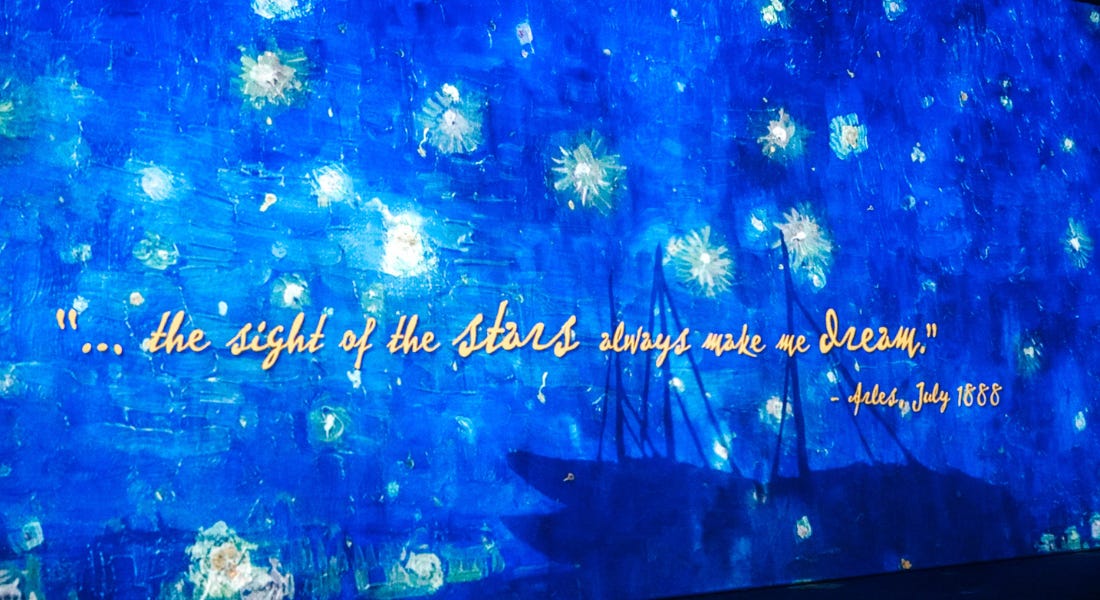 A blue painted wall with a yellow written quote on it A blue painted wall with a yellow written quote on it