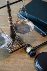 justice scales and gavel on wooden surface justice scales and gavel on wooden surface