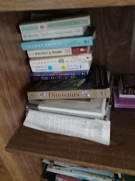 Photos of piles of books on all kinds of subjects, mostly either fiction or popular science