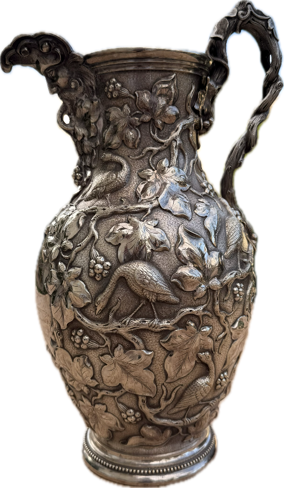 A metal vase with a handle

AI-generated content may be incorrect.