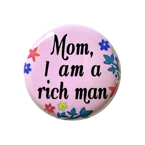 Images of pinback buttons and magnets from tanyamadoff.com
