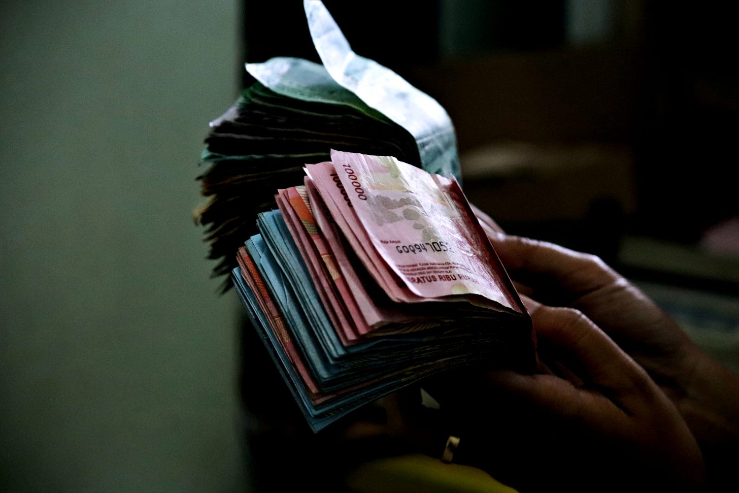 Indonesian Rupiah notes, the primary currency currently navigating a period of significant volatility in the national financial landscape.