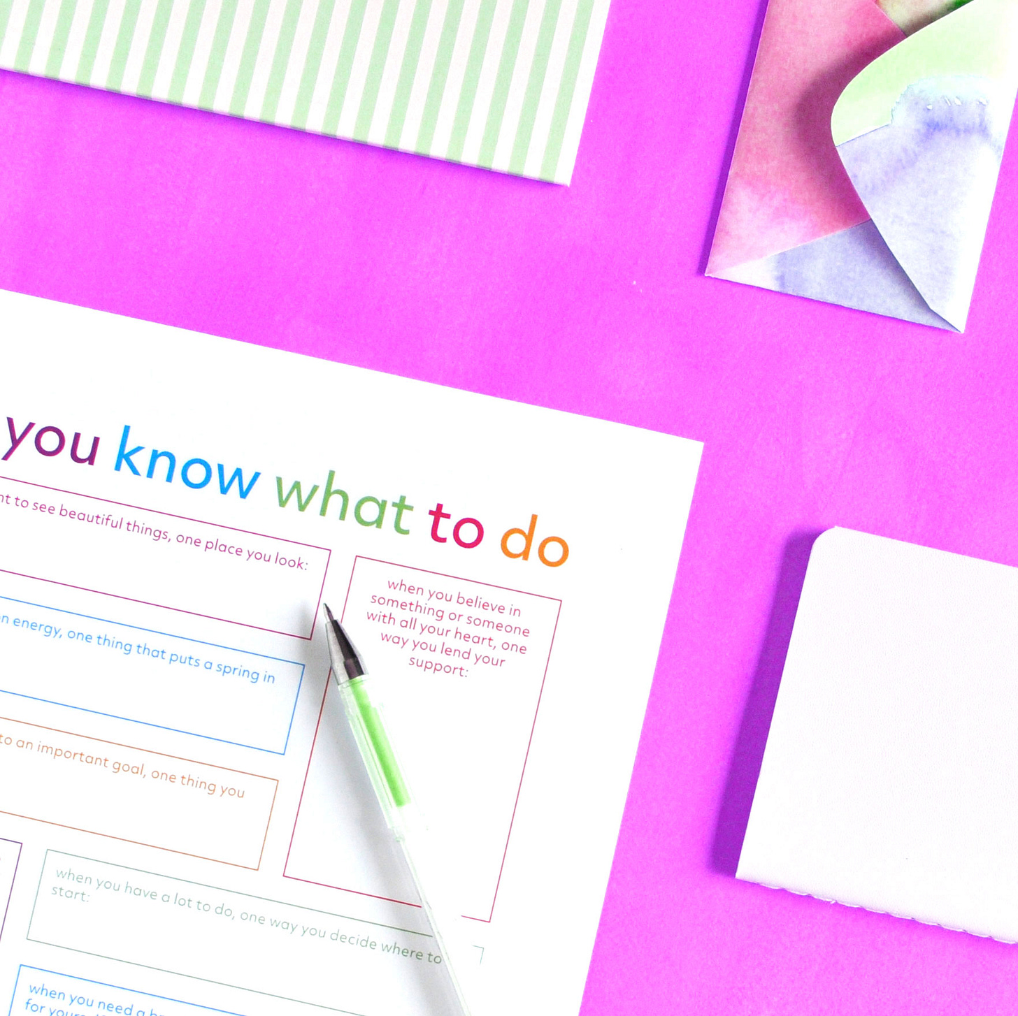 Colourful journal page titled You Know What to Do on magenta background shown with colourful pencil and notebooks.