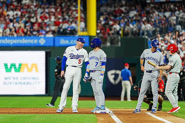 Freddie Freeman of the Los Angeles Dodgers meets with Bobby Witt Jr. #7 of the Kansas City Royals during the 96th MLB All-Star Game presented by...