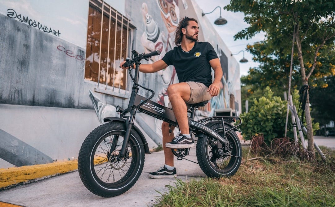 a man sitting on a motorcycle a man sitting on a motorcycle