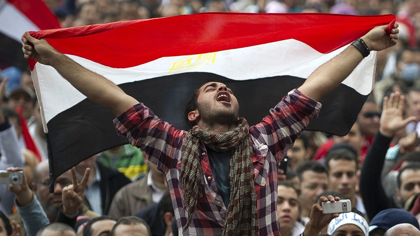 An Egyptian protester holds his national flag as he shouts slogans against President Hosni Mubarak at Cairo’s Tahrir Square in 2011. An Egyptian protester holds his national flag as he shouts slogans against President Hosni Mubarak at Cairo’s Tahrir Square in 2011.