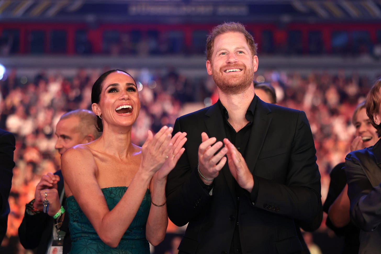 Meghan and Harry clapping