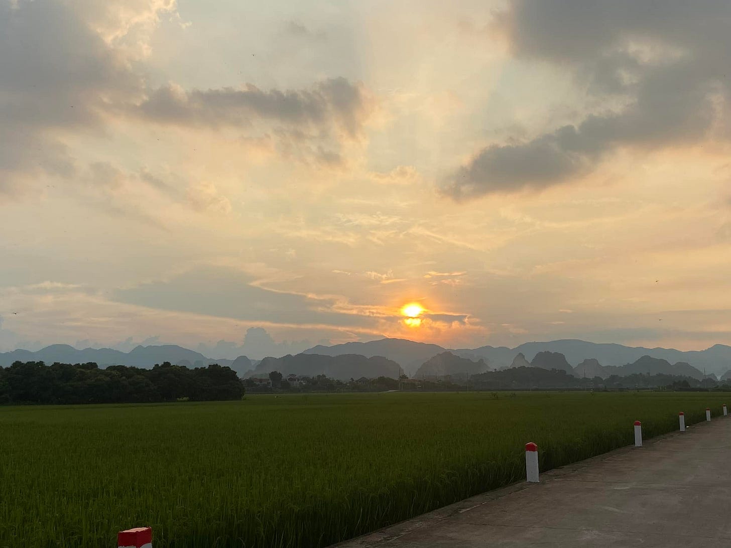 May be an image of twilight, horizon, cloud, fog, grass and road May be an image of twilight, horizon, cloud, fog, grass and road