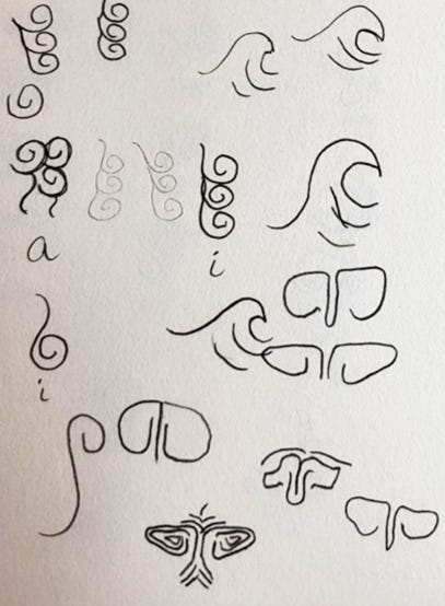 Hand-drawn swirls and wave-like symbols — first rough sketches for the Threlraan glyphs.