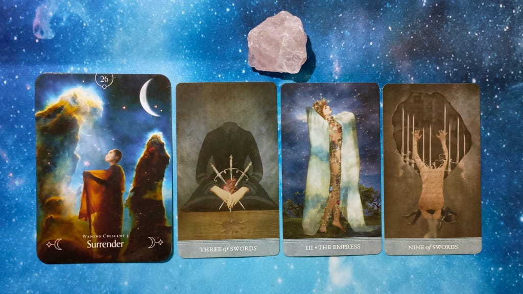 New Moon Magic: Your August 2025 Pick-a-Card Tarot Reading, pile 1 - rose quartz stone and 4 cards on a starry blue background