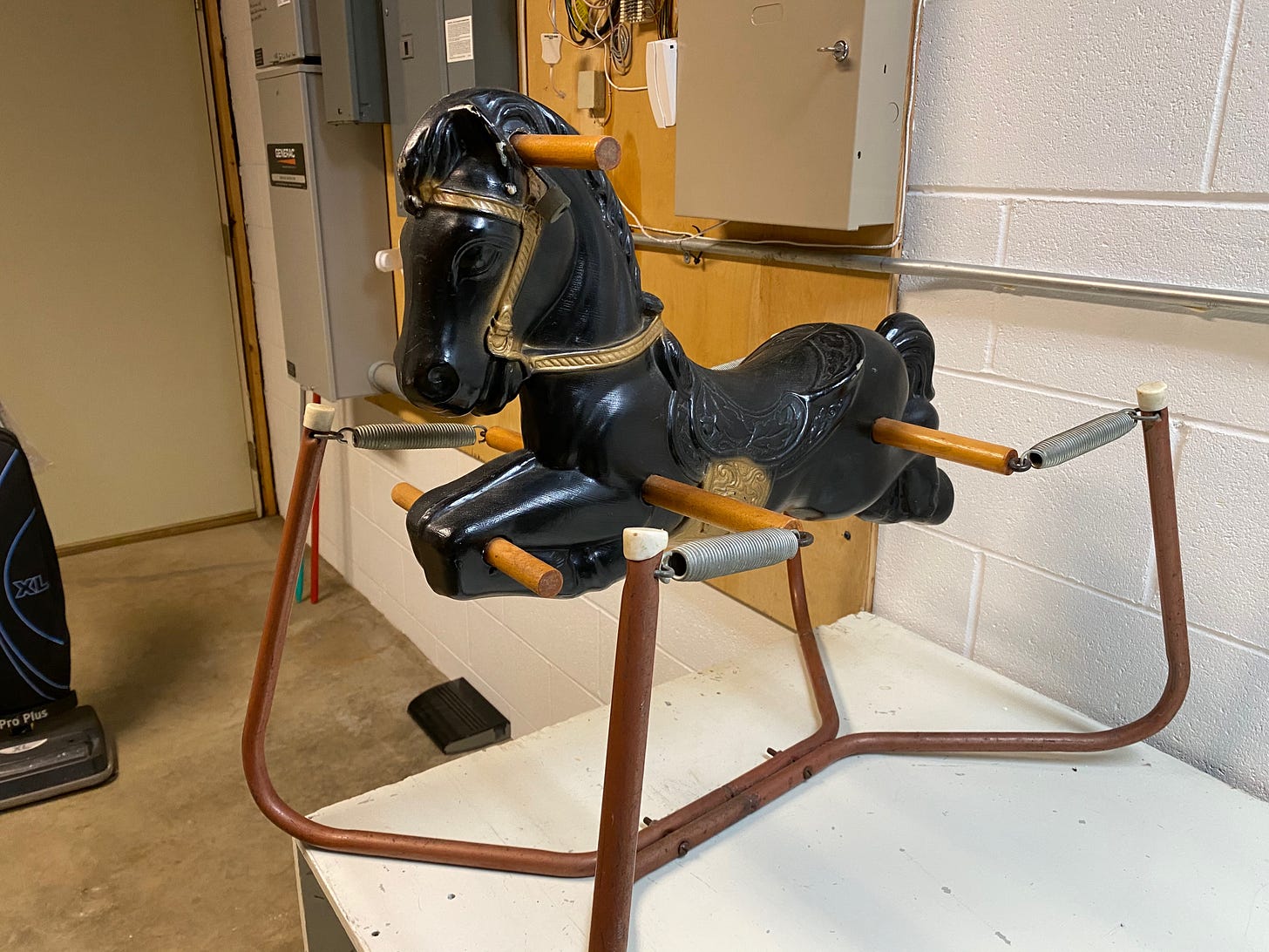 black pony toy on a bounce frame