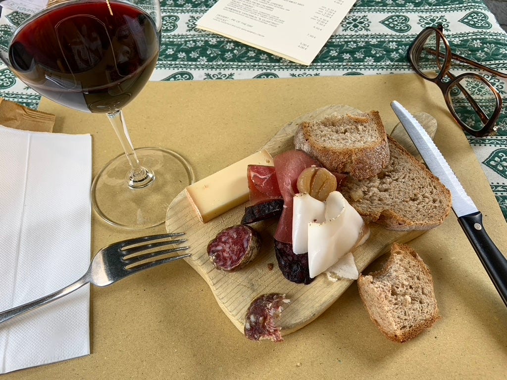 What is a tagliere? It’s a rustic sharing board that gathers cured meats, local cheeses, crusty bread, olives, and