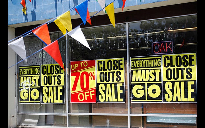 Store closing signs at a furniture store in 2009 Store closing signs at a furniture store in 2009