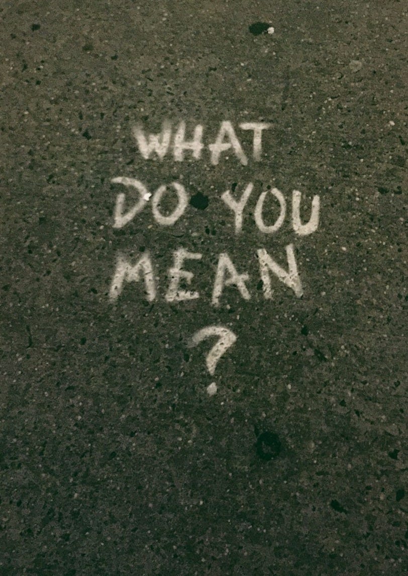 what do you mean? text on gray surface